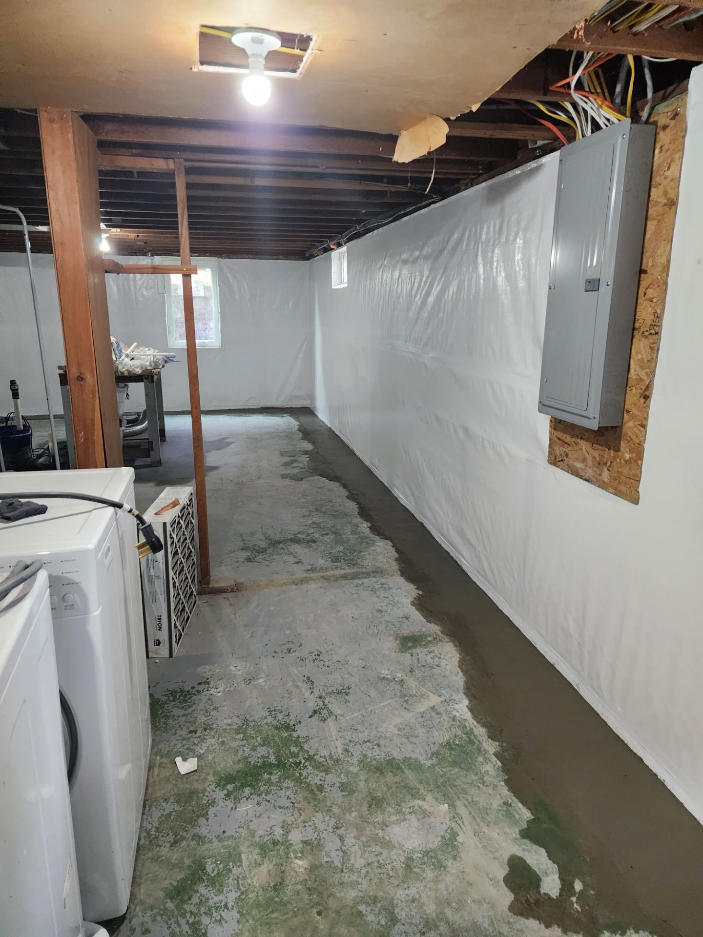 Vapor barrier membrane installed around electrical panel — Beaverdale, Des Moines, IA