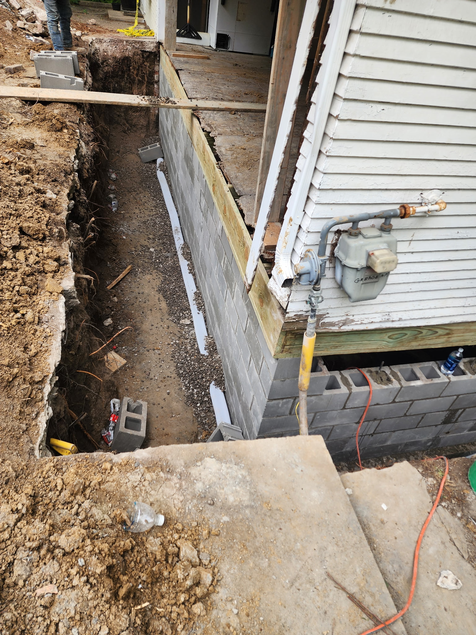 New foundation wall with waterproofing membrane applied — Raytown, MO