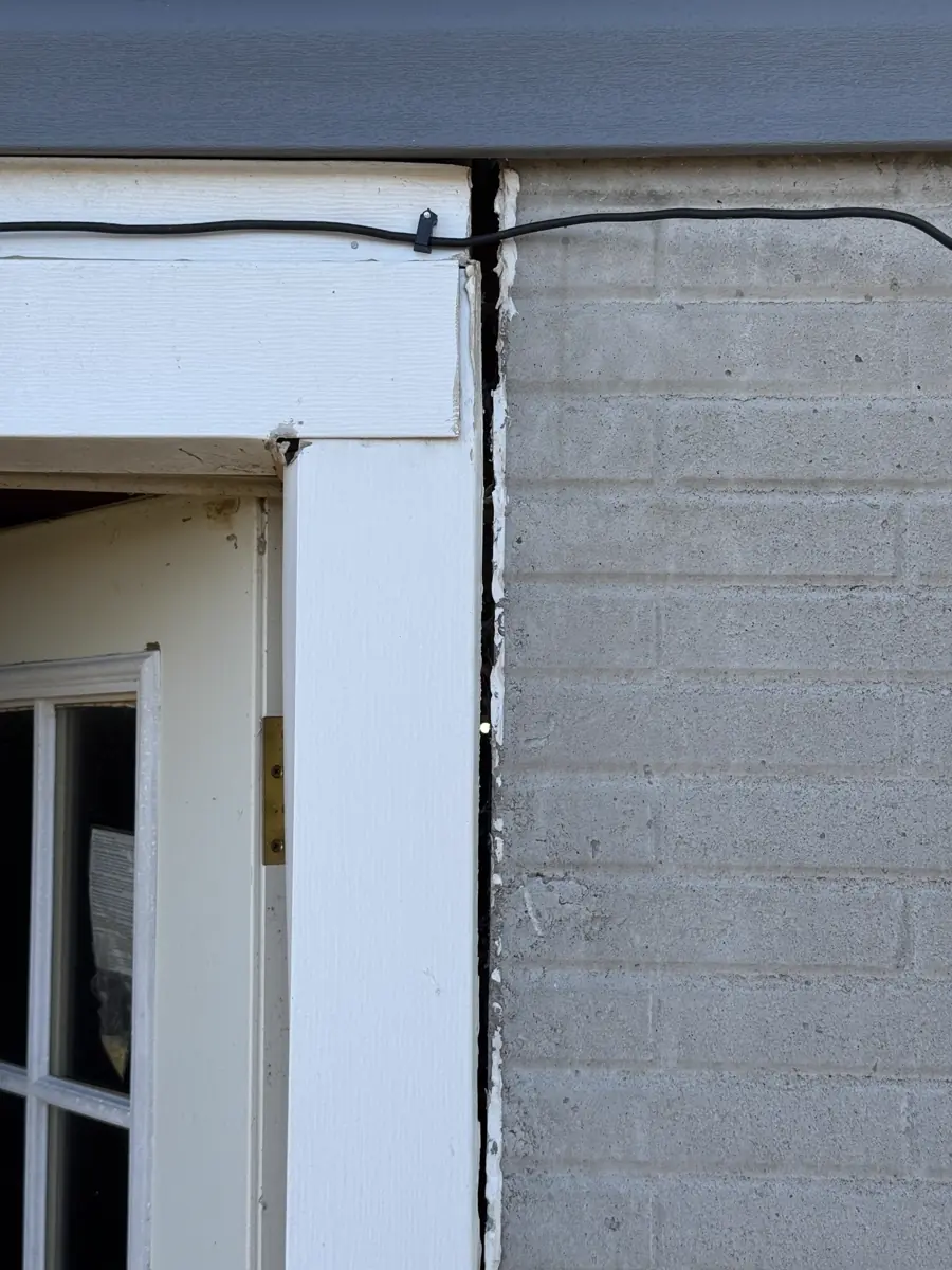 Hydraulic press driving push pier into load-bearing soil — Independence, MO