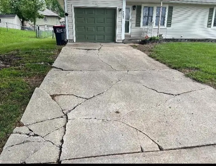 Driveway slab leveled and flush after polyjacking — Olathe, KS