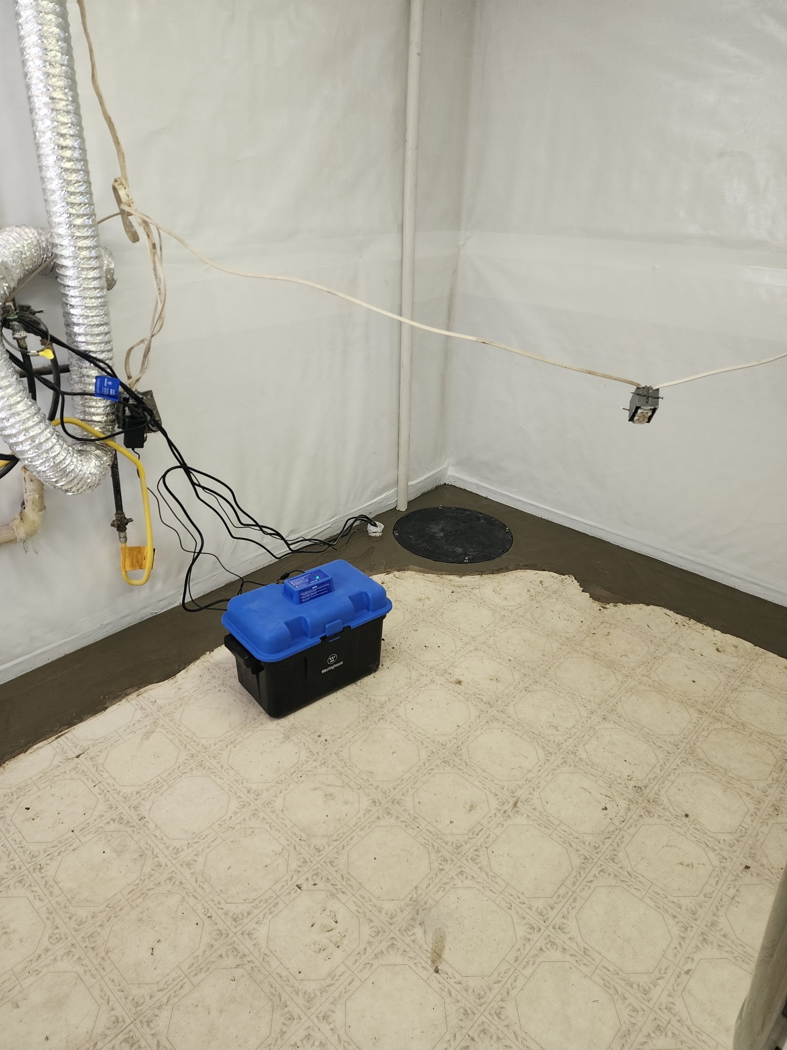 Sump pump with battery backup installed in corner — Blue Springs, MO