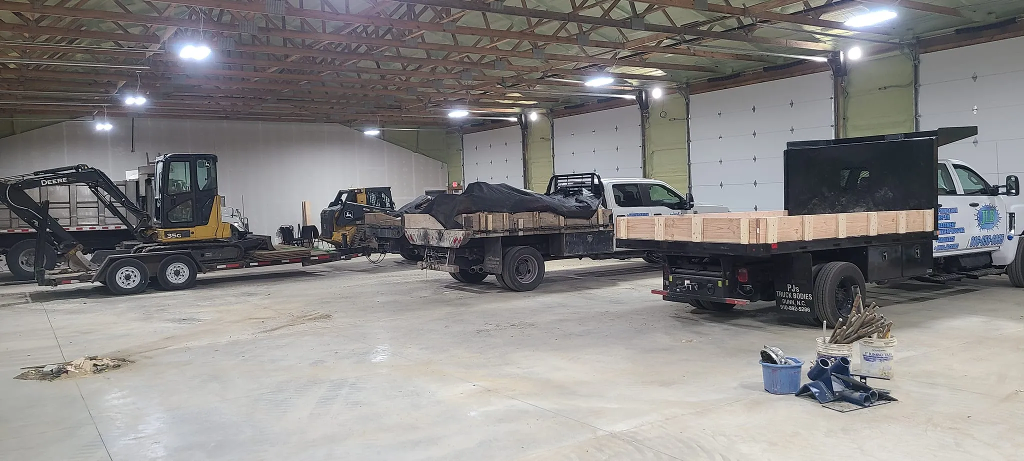 JLB Foundation Repair warehouse interior with full equipment inventory