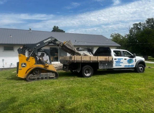 JLB skid steer handles excavation so foundation work in Colfax stays on schedule