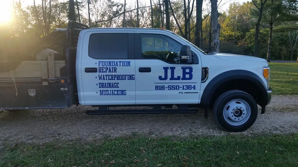 JLB work truck side profile — foundation and waterproofing service in Lenexa, KS