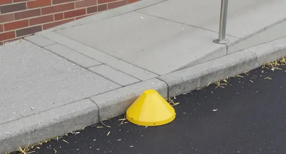 Concrete ramp curb with a detectable warning pad — ada ramps by JLB in Urbandale, Iowa