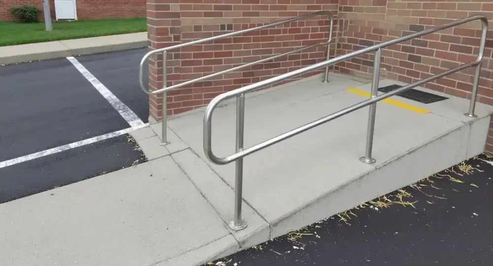Concrete curb ramp with a detectable warning panel — ada ramps by JLB in Urbandale, Iowa