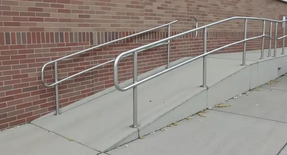 Long concrete accessibility ramp with a handrail — ada ramps by JLB in Urbandale, Iowa
