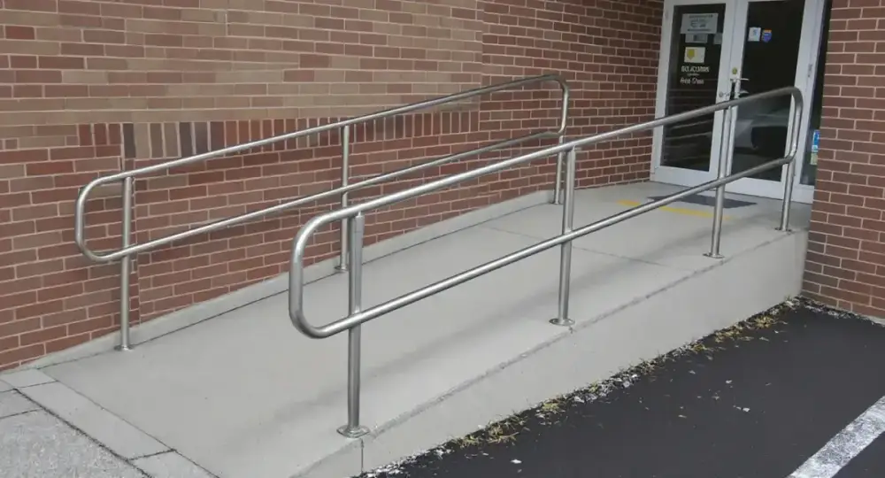 Switchback concrete accessibility ramp with railings — ada ramps by JLB in Urbandale, Iowa