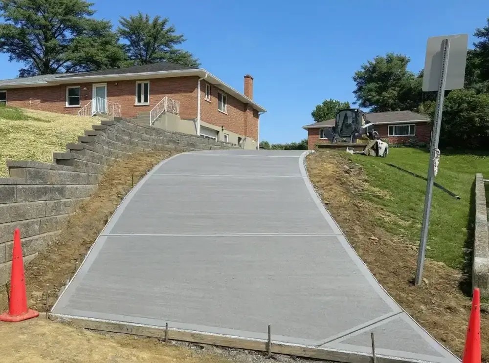 Sandstone-colored concrete driveway — driveways by JLB in Waukee, Iowa