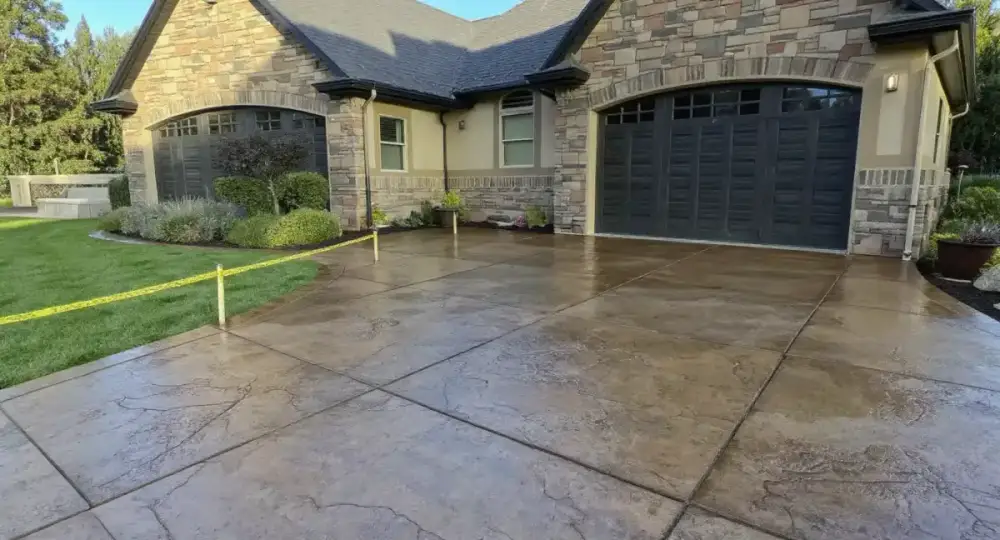 Stamped stone-pattern concrete driveway — driveways by JLB in Waukee, Iowa