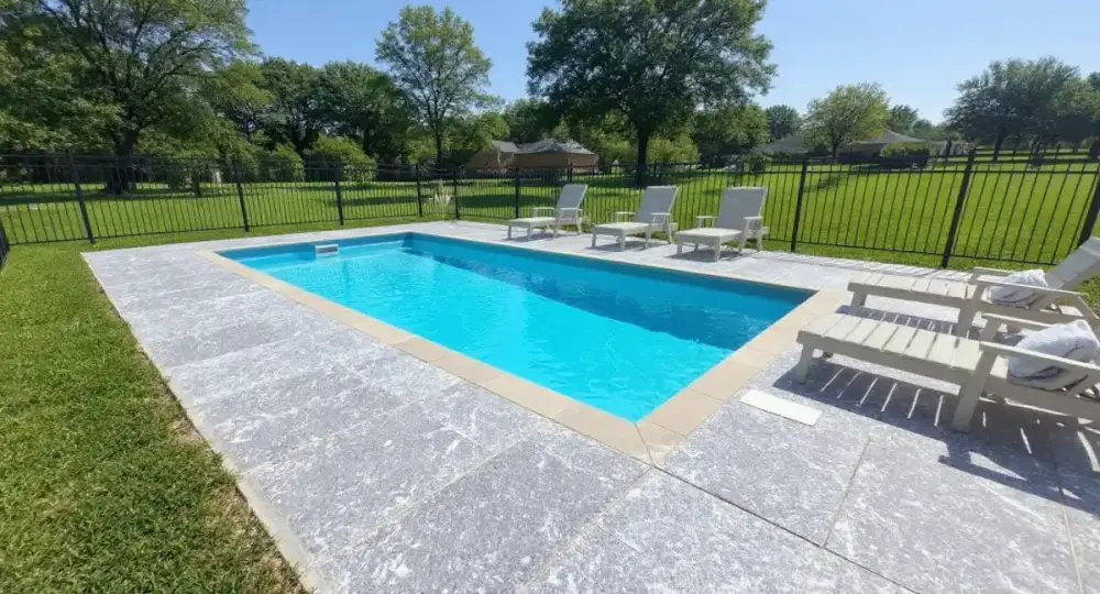 Concrete pool deck at the water edge in Ames, Iowa