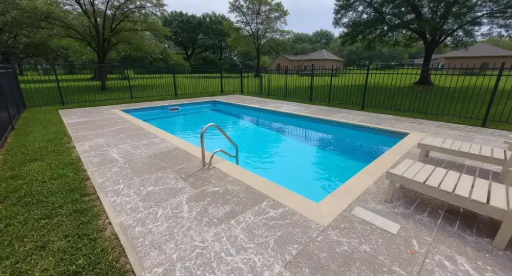Concrete pool deck with steps and handrail — pool decks by JLB in Clive, Iowa