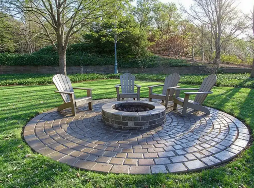 Cobblestone stamped concrete with fire pit — stamped concrete by JLB in Altoona, Iowa