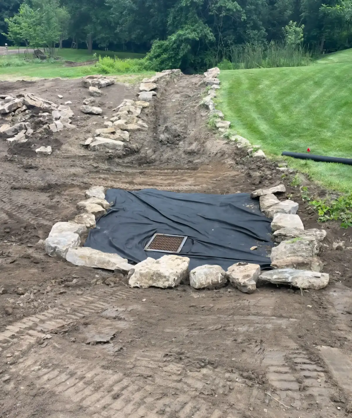 Completed drainage project with proper grade away from home