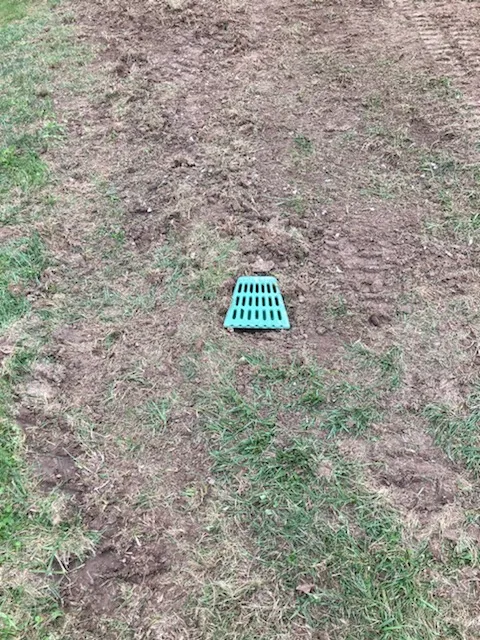 French drain installation with gravel and perforated pipe