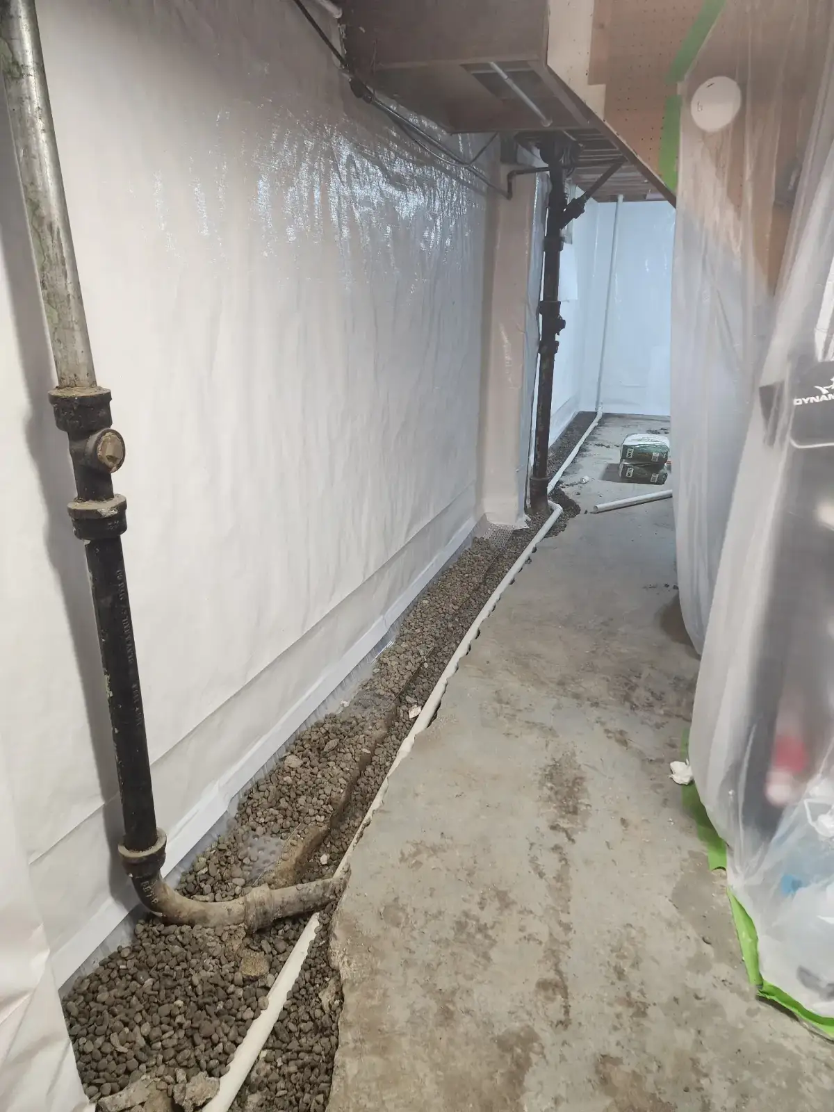 Completed foundation piering project with steel supports visible