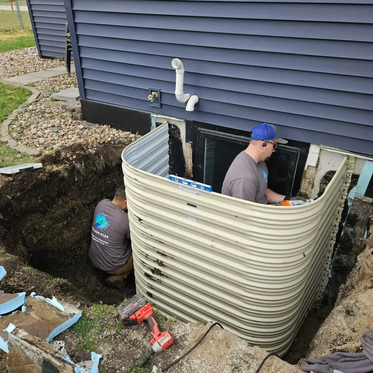 Framing an egress window well in open soil at a Johnston home — JLB Foundation Repair