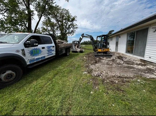 JLB truck and crew excavating at a foundation job in Clarion, IA