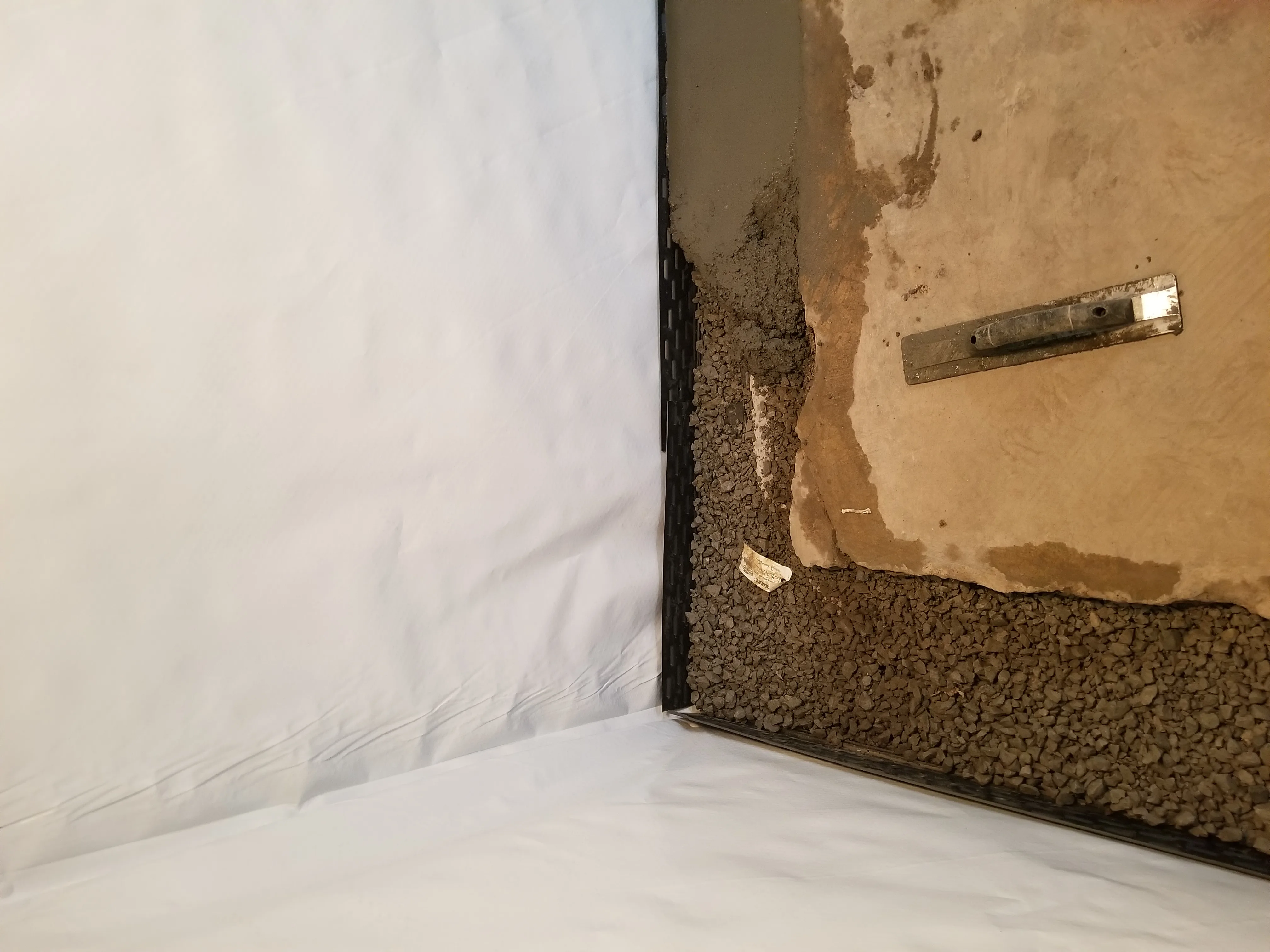 Hardin County basement waterproofing — drain tile and vapor barrier, JLB crew